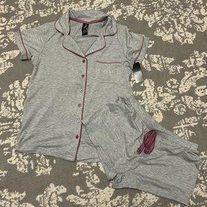 Pajama set comes with one button down pajama shirt and matching pj shorts.